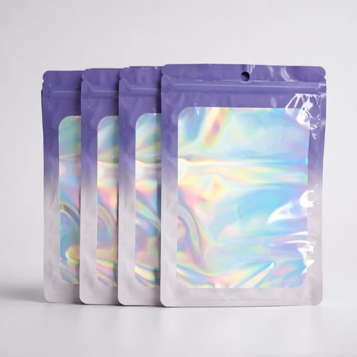 Bolsa Zipper Holográfica Lila con Ventana 10x18 cm / 100 unidades
