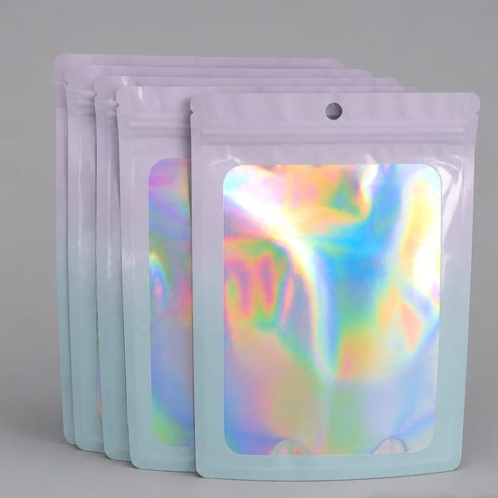 Bolsa Zipper Holográfica celeste con Ventana 14x20 cm / 100 unidades